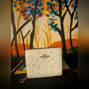 Coach Off White Embossed Compact Wallet